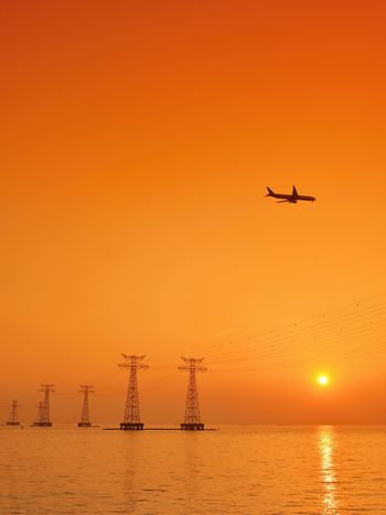 An airplane landing off over the sea